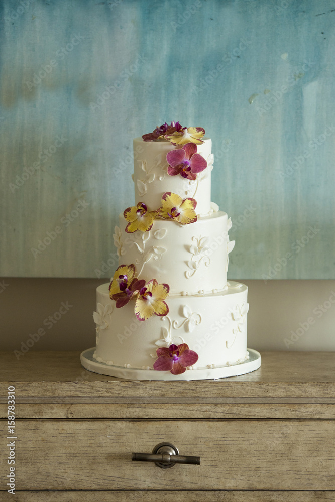 Three tier wedding cake with orchids Three tier wedding cake with orchids