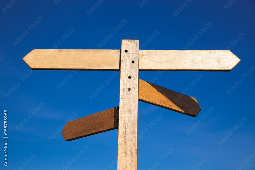 empty wooden signboard against blue sky empty wooden signboard against blue sky
