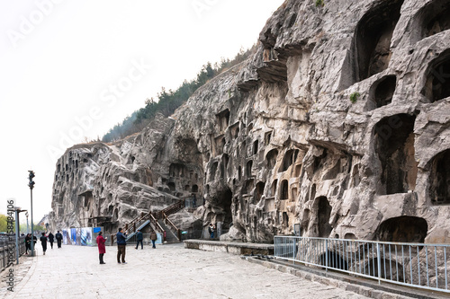 people near caves in slope of West Hill in Longmen photo