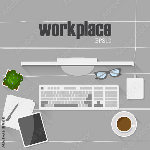 Set of digital devices and office supplies on wooden working table