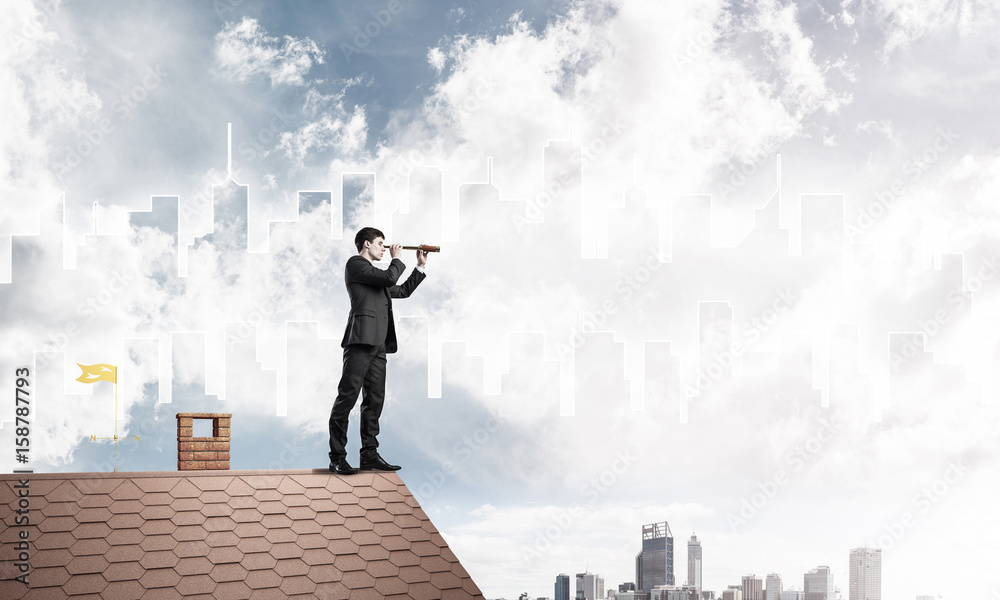 Engineer man standing on roof and looking in spyglass. Mixed med Engineer man standing on roof and looking in spyglass. Mixed med