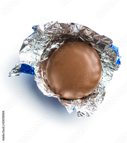 Chocolate biscuit wrapped in aluminium foil.