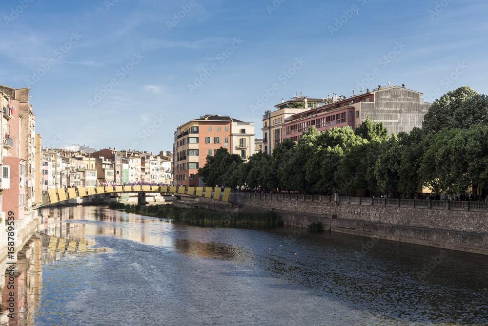 Girona city center river bridge on a blue sky sunny day