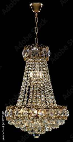 Large crystal chandelier isolated on black background. photo