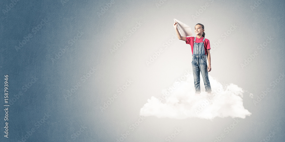 Concept of careless happy childhood with girl dreaming to become Concept of careless happy childhood with girl dreaming to become