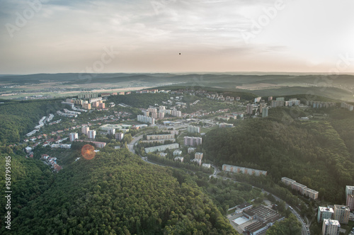 Panorama view of housing estate between wooded hills in Brno, Czech Republic