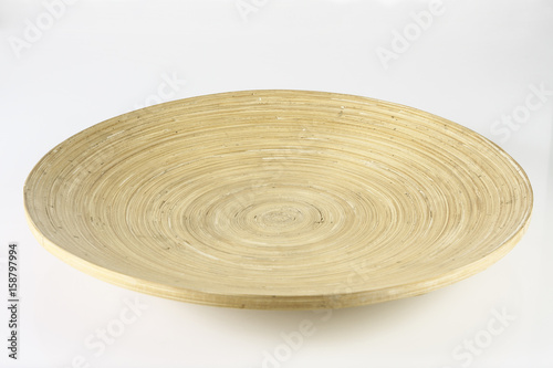 Empty bamboo plate on white background isolated