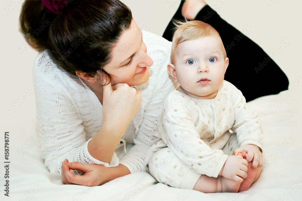 Mom is looking at cute baby