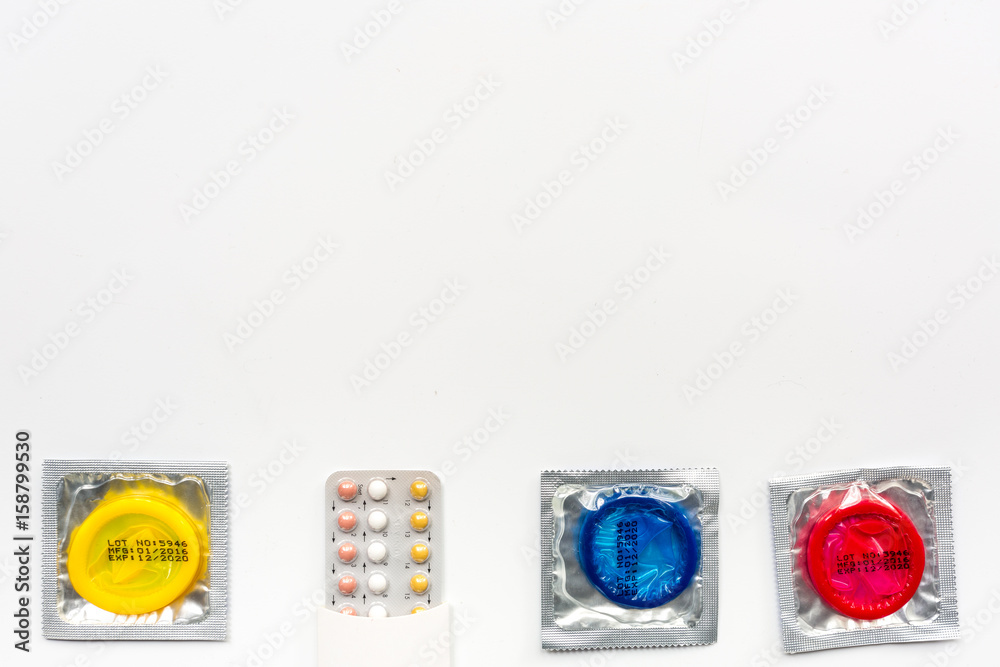 condoms and pills for male contraception and birth control white background top view mockup condoms and pills for male contraception and birth control white background top view mockup