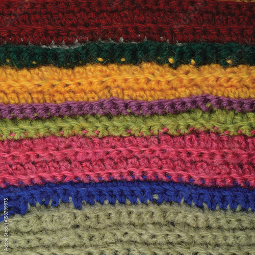 Knitted fine wool garment colorful stripes background natural texture, yellow, beige, claret, blue, green scarf macro closeup, large detailed textured knit pattern, horizontal woolen © Brilt