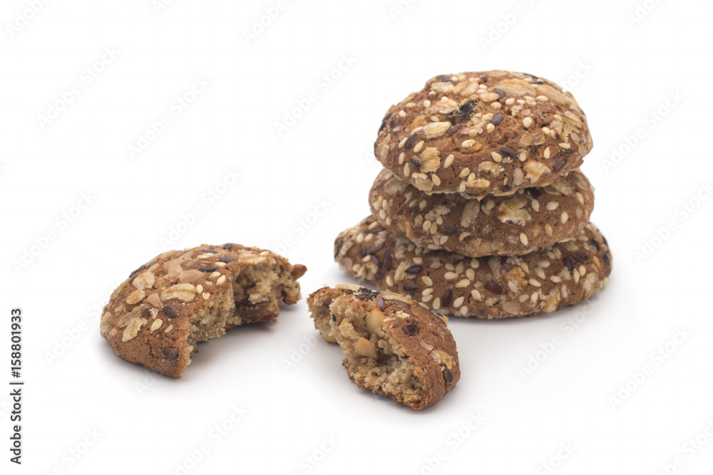 Broken oatmeal cookies on a white background