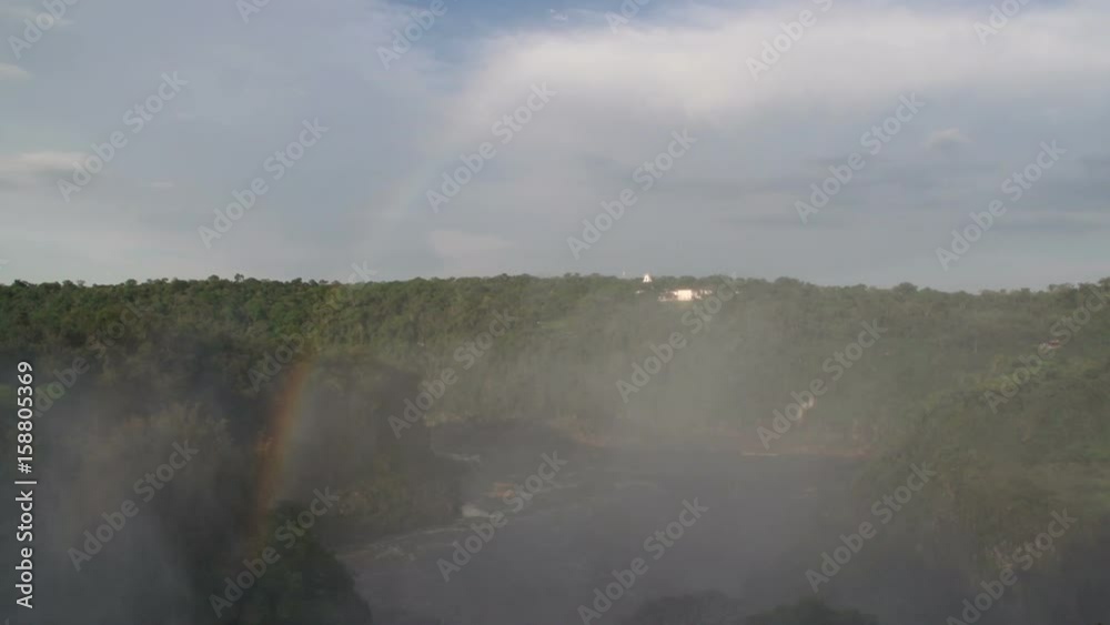Iguazu River below the waterfall with rainbow Iguazu River below the waterfall with rainbow