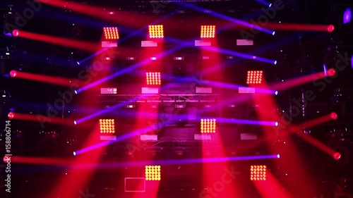 Colorful laser lights on the stage. Professional color lighting and sound show effects. Background of concert light flashes