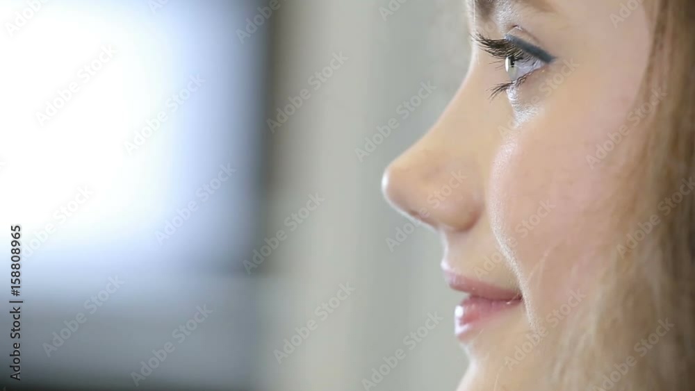 close up professional hairdresser stylist curling up teen girl hair
