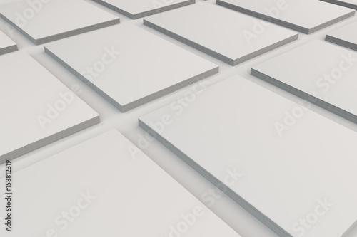 Stacks of white flyers on white background