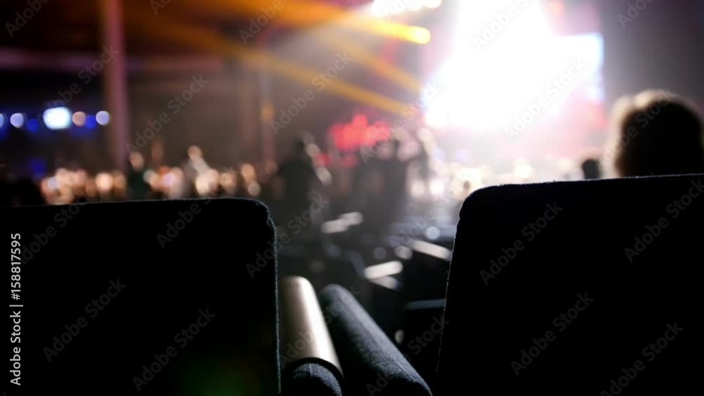 People sit at a rock concert - music background People sit at a rock concert - music background