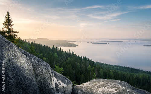 Scenic landscape with lake and sunset at evening in Koli, national park.