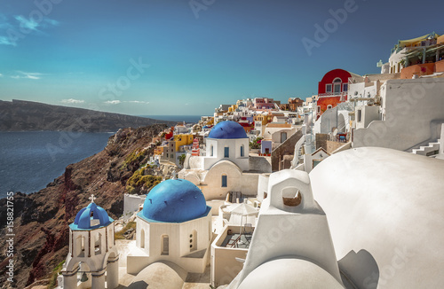 Santorini traditional blue dome churches on the cliff, Greece. Cyclades Islands. Vintage colors