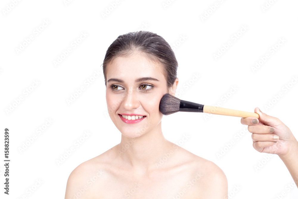 Makeup artist applies brushed at woman face. Beautiful woman face. Perfect makeup, isolated on white background, 20s year old. Makeup artist applies brushed at woman face. Beautiful woman face. Perfect makeup, isolated on white background, 20s year old.