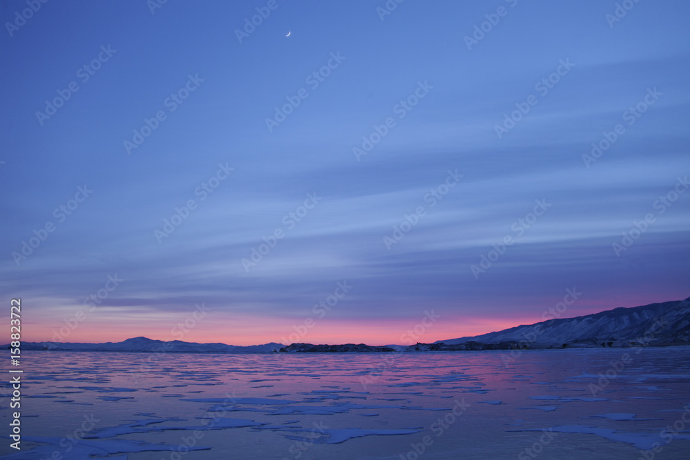 Lake Baika. Cape Uyuga sunset winter landscape
