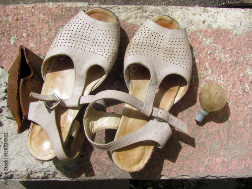Old sandals, old light bulb