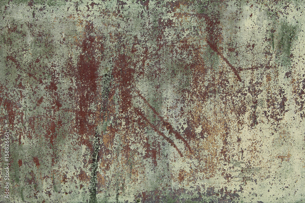 The old sheet, damaged by corrosion of steel with spots of exfoliating, faded green paint. Background for your design The old sheet, damaged by corrosion of steel with spots of exfoliating, faded green paint. Background for your design