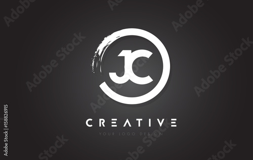 JC Circular Letter Logo with Circle Brush Design and Black Background. photo