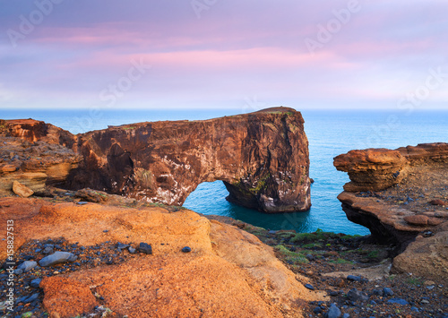 Evening landscape with views of the rocky cape and ocean in Iceland