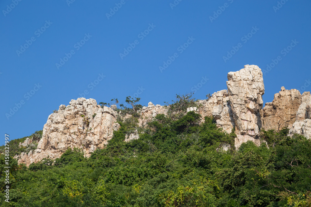 Tall sharp cliff of Khao Sam Muk mountains, in Chonburi, Thailand