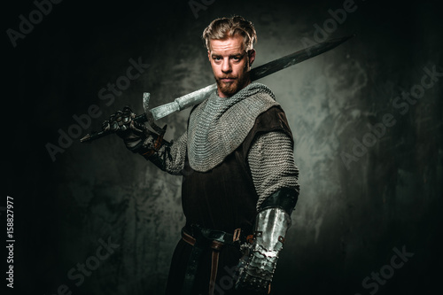 Medieval knight with sword and armour © Nejron Photo