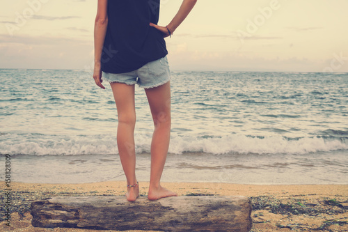 Attractive fashionable woman enjoying on the tropical beach. © Kitja