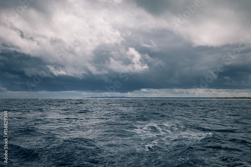 Gloomy weather at sea with rain clouds