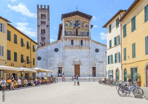 Facade of Basilica San Frediano in Lucca, Tuscany, decorated with golden 13th century mosaic representing Ascension of Christ with apostles below, in a Byzantine style by Berlinghiero Berlinghieri  photo