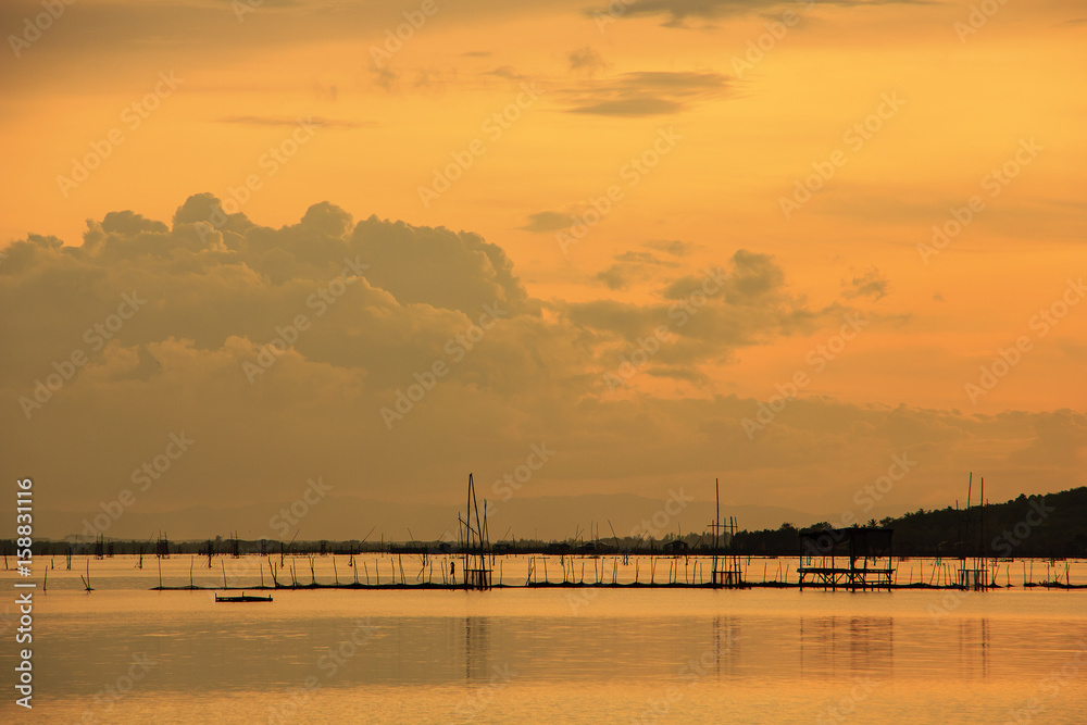 View of Songkhla lake which has fish cage in water at sunset ; Koh Yor, Sonkhla province, Thailand
