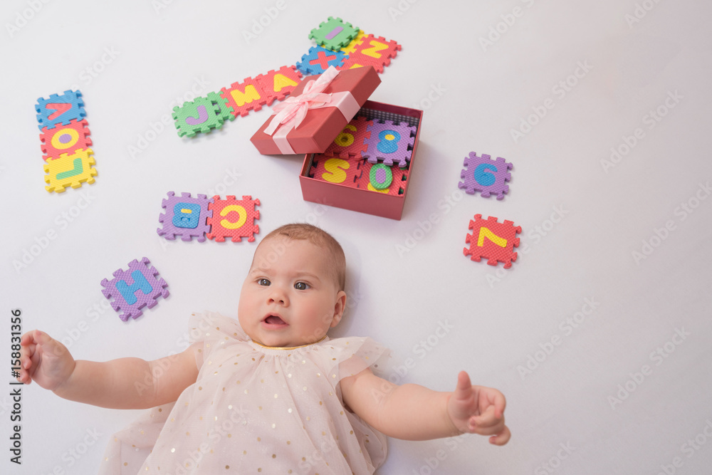 baby on the bed in her room baby on the bed in her room
