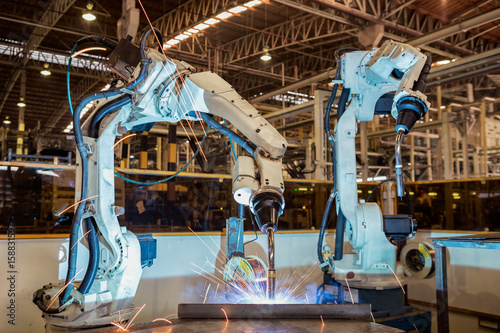 Industrail robot are test run new program in automotive  factory