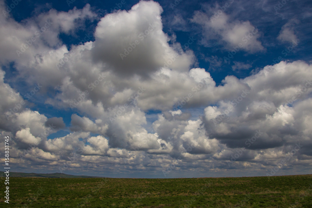 Amazing clouds and sky. Steppe in spring, Kazakhstan Amazing clouds and sky. Steppe in spring, Kazakhstan