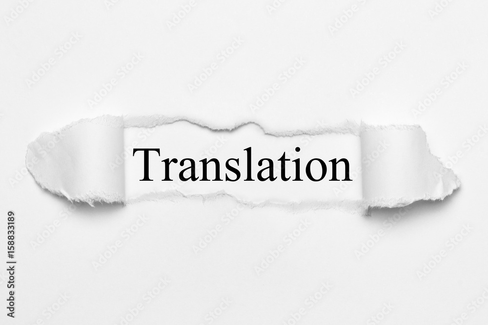 Fototapeta premium Translation on white torn paper