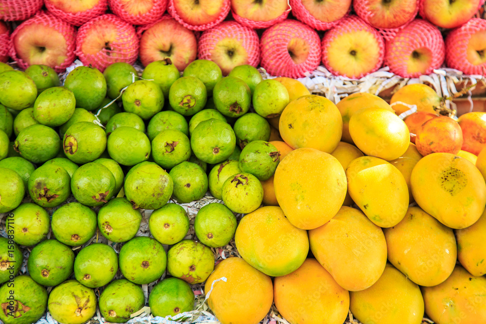 Mango, lime, apples in  Indian market.