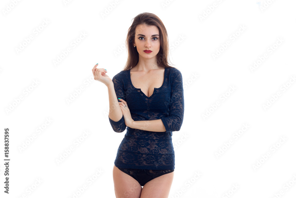 beautiful young brunette in lace blue body stands in front of a camera beautiful young brunette in lace blue body stands in front of a camera