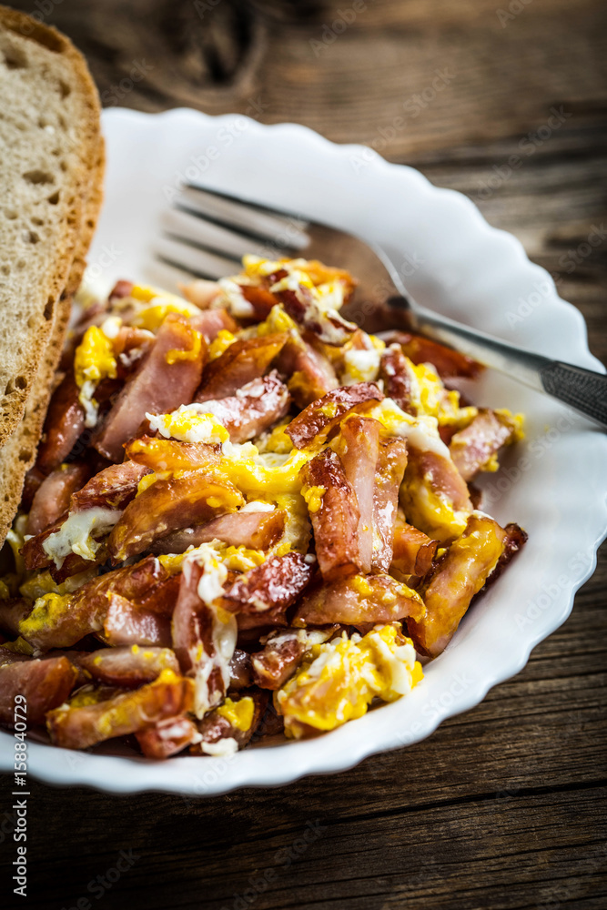 Pieces of sausage fried with egg. Pieces of sausage fried with egg.