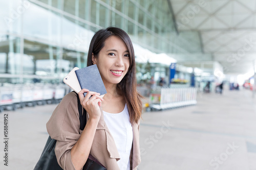 Woman go travel with her passport © leungchopan