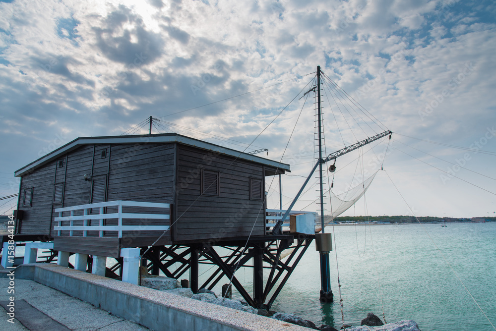 Fishing huts in the canal harbor of Cesenatico. Romagna coast Fishing huts in the canal harbor of Cesenatico. Romagna coast