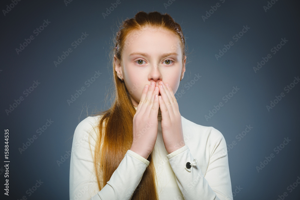 Closeup Scared and shocked little girl. Human emotion face expression Closeup Scared and shocked little girl. Human emotion face expression