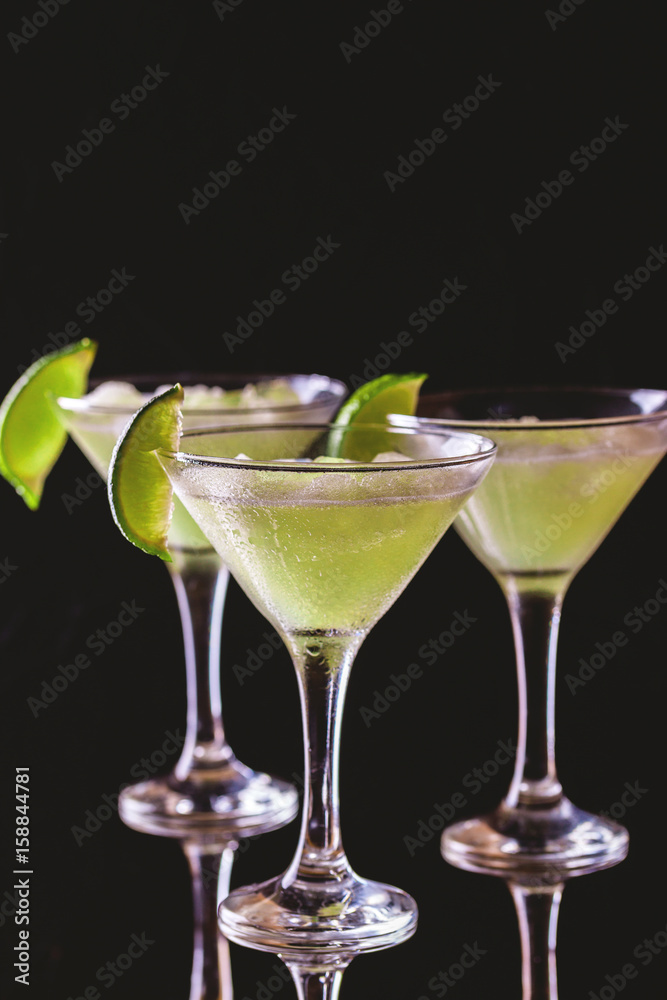 Classic daiquiri cocktail with lime, ice and mint