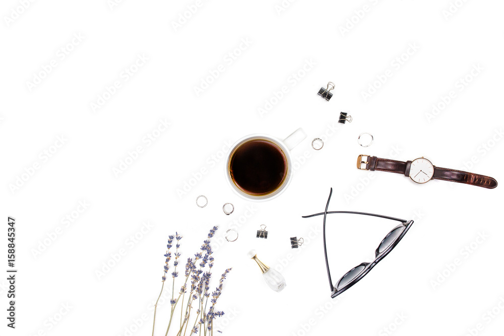 Workplace for the desktop with lavender, glasses, clock, rings and clips on a white background. Flat layout, top view