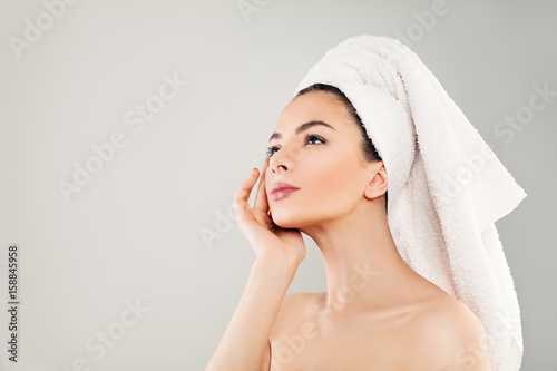 Spa Beauty. Cute Young Woman with Healthy Skin Looking Up