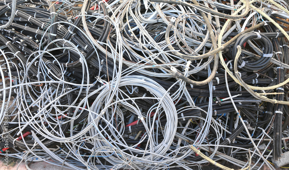pile of used electrical cables in the landfill