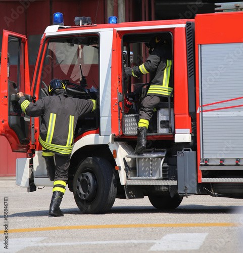 Fire trucks and firefighters with uniforms
