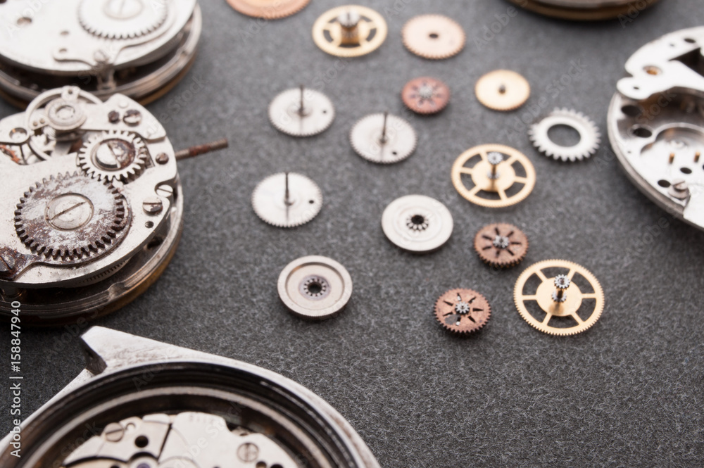 Detail of watch machinery on the table. Detail of watch machinery on the table.
